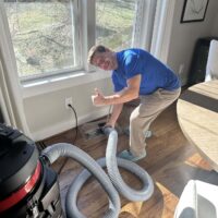 dryer vent superheroes franchise tech doing work in a customer's home