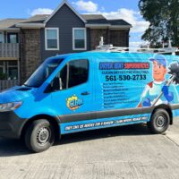 Dryer vent superheroes van parked in front of a customer's home