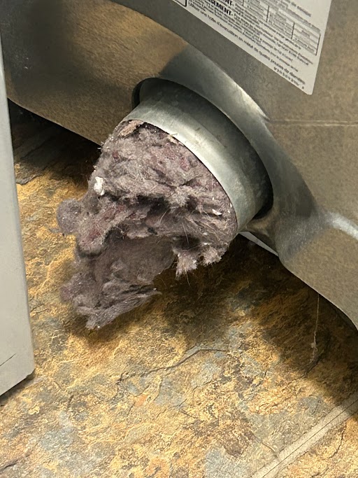 dryer vent full of lint in a customers home, causing a fire hazard